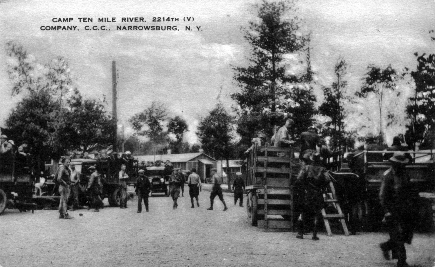 Men at the Ten Mile River CCC camp load trucks.